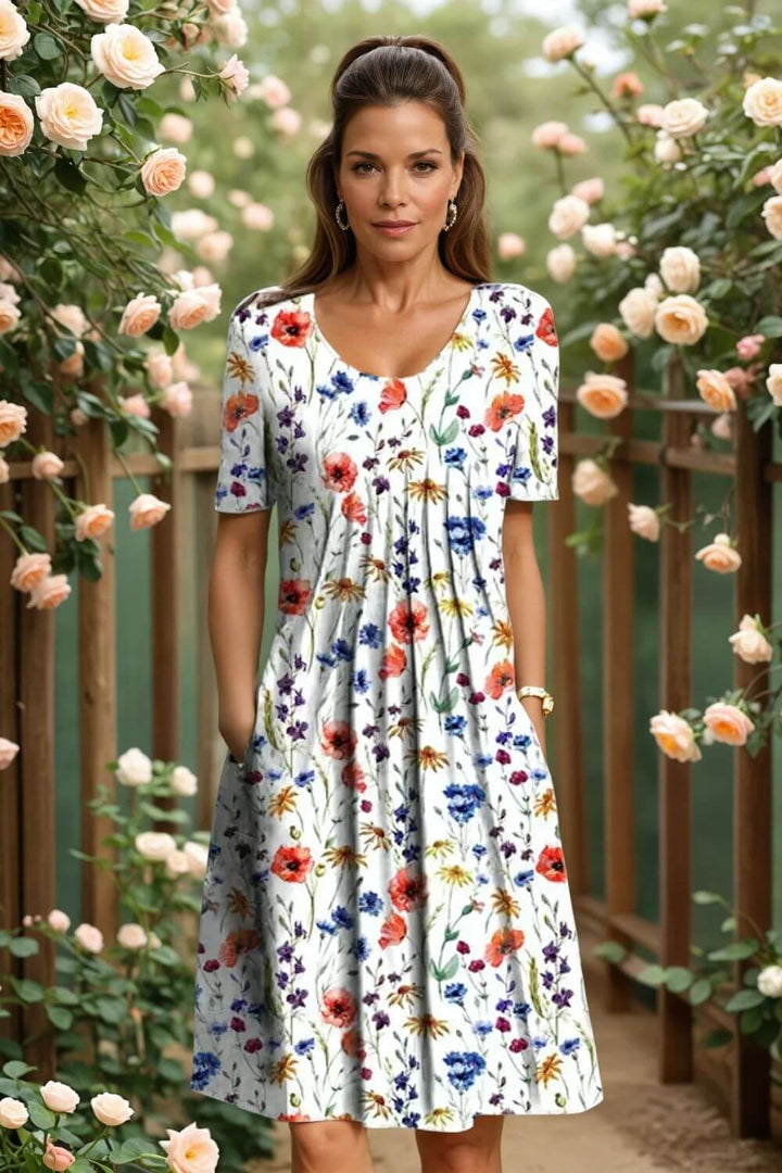 Agnes™- Elegant blomsterkjole med magevennlig passform